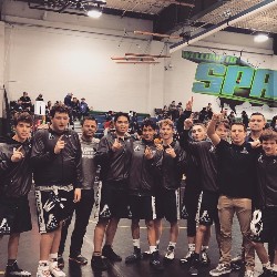 The AAHS wrestling team poses during a meet.